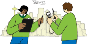 Two people measuring air quality in Seattle